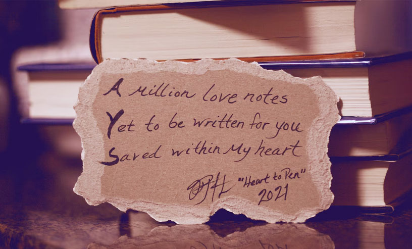 An artistic display of a quote by William Shakespeare, paired with a song writing book to inspire creativity.